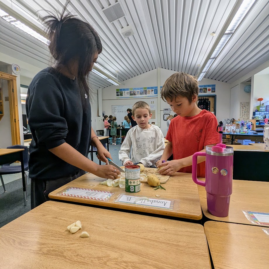 Students chopping vegetables